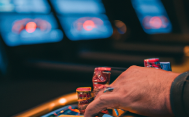 An image capturing the vibrant atmosphere of Grandx Casino in Estonia, showcasing the sparkling slot machines, elegant card tables, and enthusiastic gamblers immersed in high-stakes games